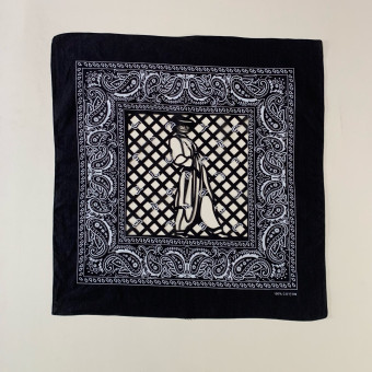 A visual intersection of tradition, style, and resistance Black cotton bandana featuring stylized zoot suiter framed by paisley border and papel picado grid pattern